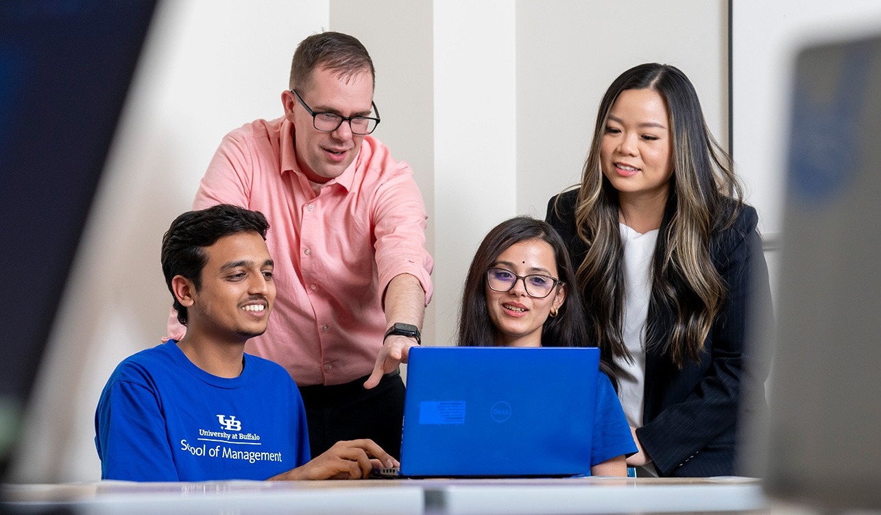 Professors Michael Krupski and Cassie Nguyen with graduate students Abhishek Harihar and Kavita Pant in the Projects Clinic space in Alfiero Center. 