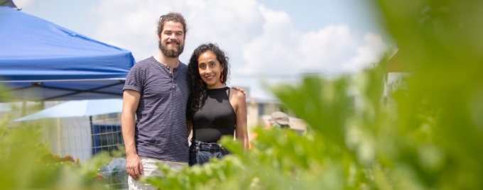Students Timothy Madden and Gabriela Cordoba Vivas at a farmer's market. 