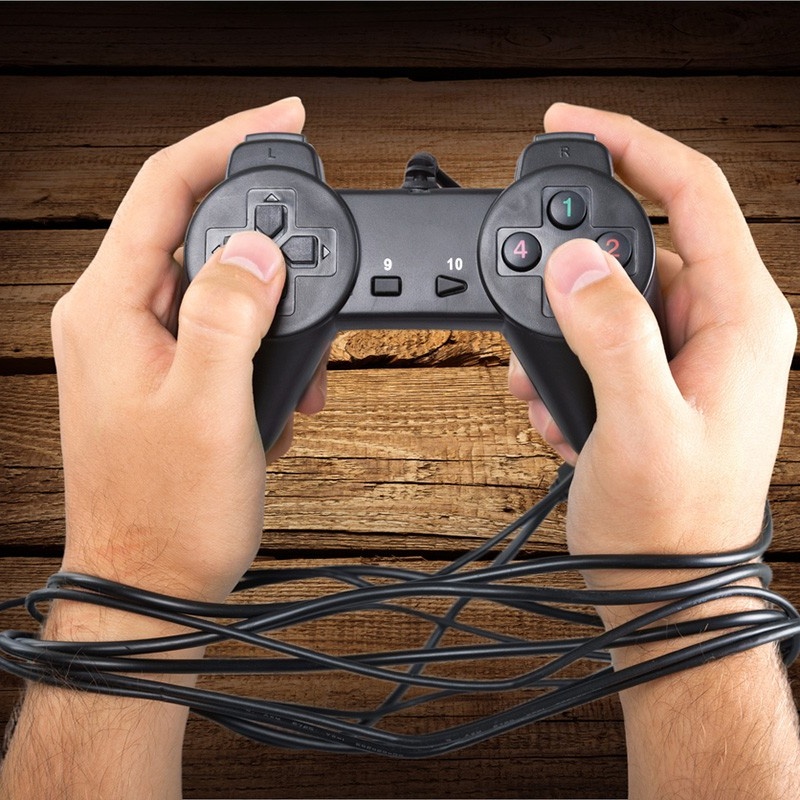 Hands holding a video game controller. 