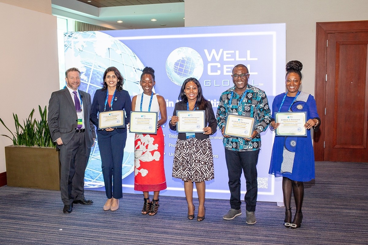 Photo of Well Cell CEO Scott Hepford with Meghna Prakash, Natalie Fowler, Genny Wutoh, Peter Kwasi Kodjie (accepting on behalf of Jemilatu Bawa) and Evelyn Ngwenya. 