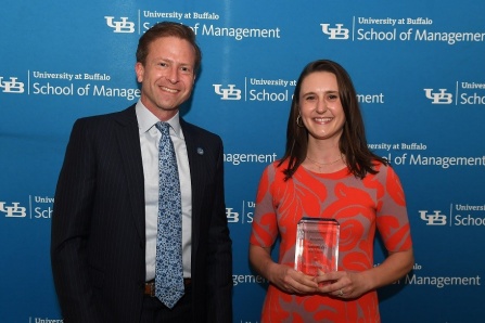 Dean Paul Tesluk and Liz Zak holding her Recruiter of the Year award from the Career Resource Center. 