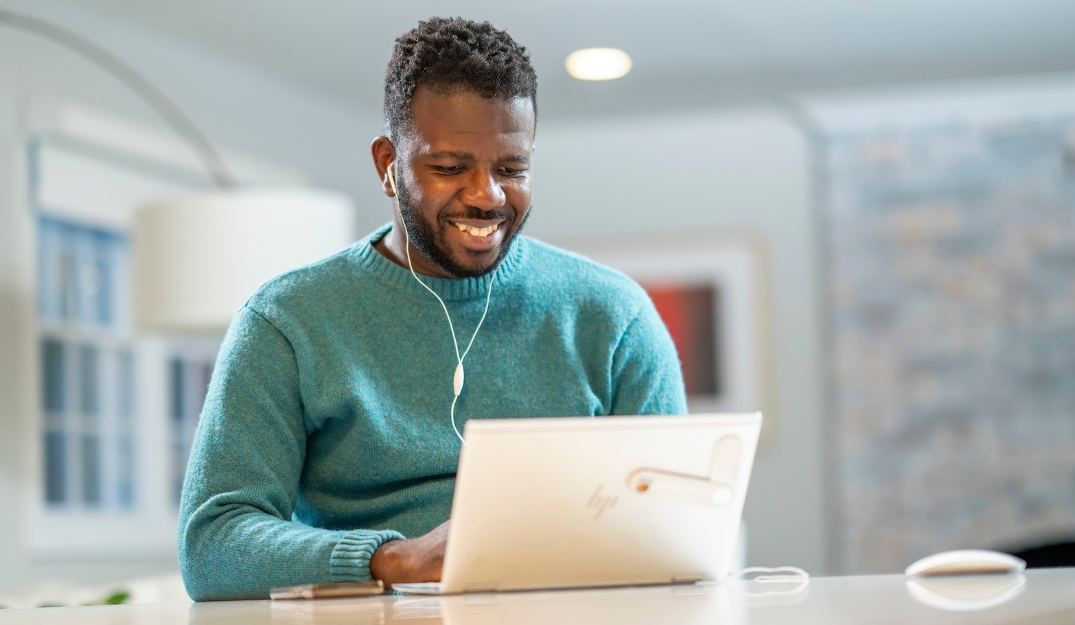 man smiling on computer. 