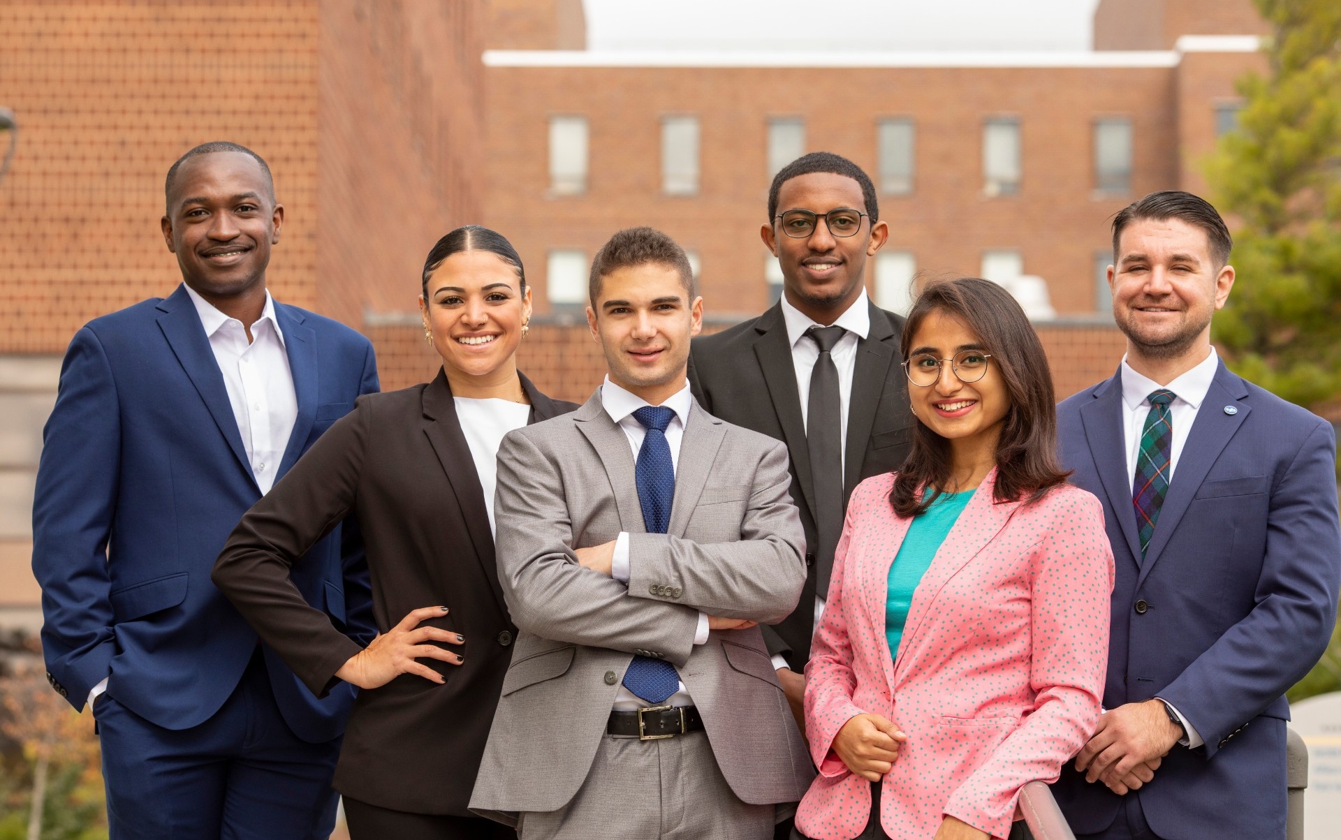 a group of students in suits. 