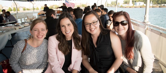 Four female students sitting on a boat. 