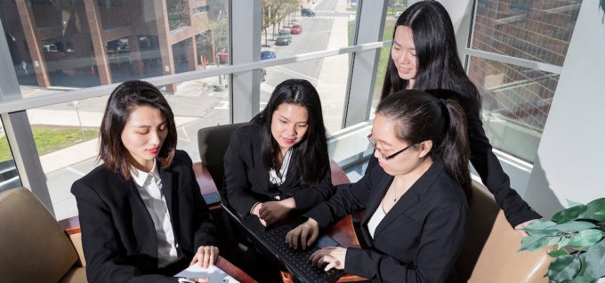 Four female MS Accounting students in Alfiero Center. 