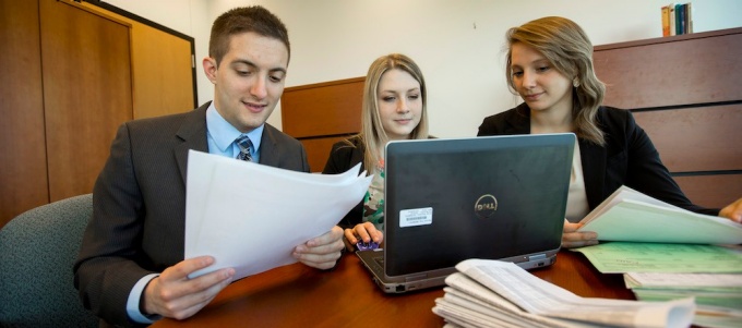 Three UB School of Management students. 