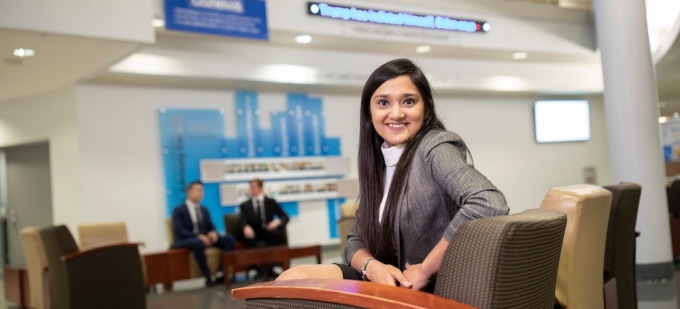 Female UB MS Finance student in Alfiero Center. 