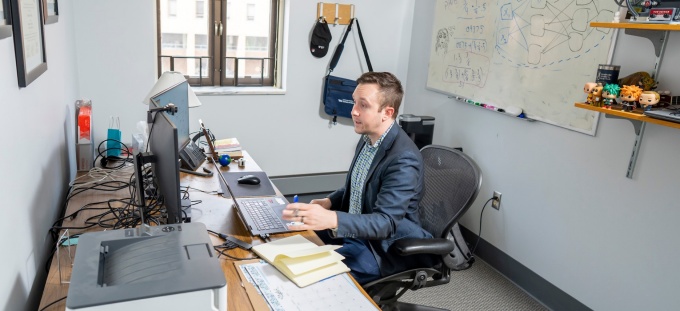 Online MSBA Faculty Director Dominic Sellitto at his desk speaking with a student during online office hours. 