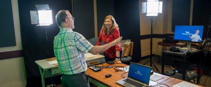 Online MBA Faculty Director Charles Lindsey and Associate Dean Natalie Simpson prepare to teach an online class. 