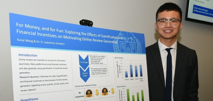 PhD in Management student at the PhD Showcase poster presentation. 