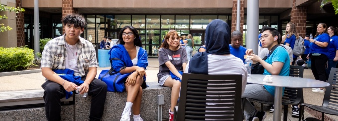 Undergrad Students outside of Jacobs Management Center. 