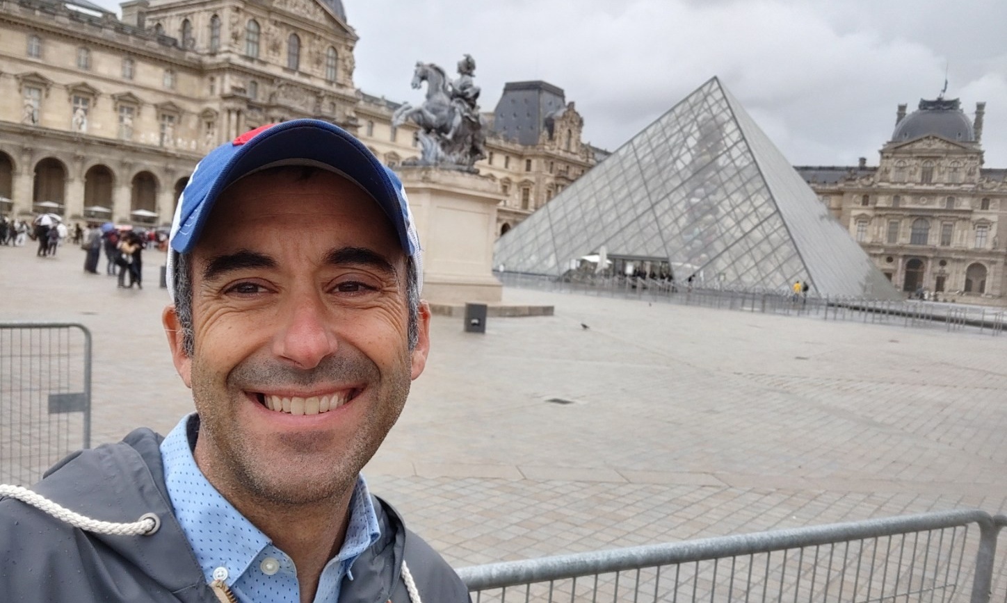 Michael Dambra in front of the Louvre in Paris. 