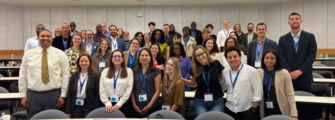 Attendees posing for a photo at the conference. 