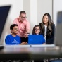 Professors Michael Krupski and Cassie Nguyen with graduate students Abhishek Harihar and Kavita Pant in the Projects Clinic space in Alfiero Center. 