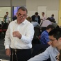 Scott Warman, treasurer at M&T Bank, leads an activity using spaghetti noodles to spark creativity. 