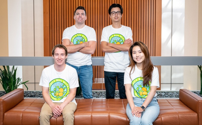 Four students wearing Project Run With It tee shirts. 