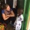 UB School of Management student talks with Tanzania resident. 