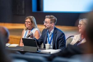 Benjamin Sio, senior vice president of strategy, policy and planning at CenterState CEO, responds to questions from the audience during a panel discussion. 